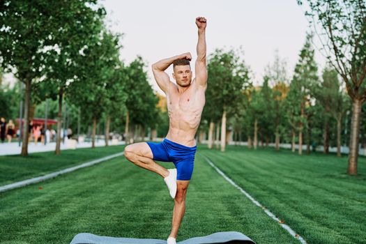 man doing sports in the park outdoors cardio CrossFit. High quality photo