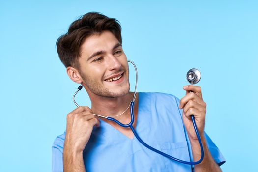 man in medical uniform health care treatment stethoscope examination blue background. High quality photo