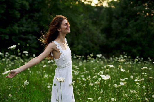 pretty woman in white dress field flowers freedom nature. High quality photo