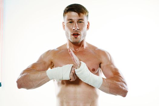 muscular man with bandaged arms gym boxer. High quality photo