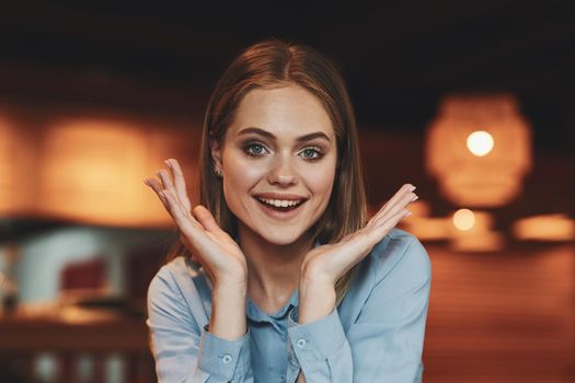 Business woman in a cafe in the summer outdoors on vacation. High quality photo