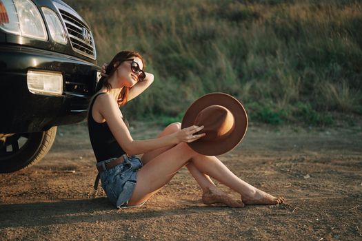 woman in sunglasses near car travel summer vacation landscape. High quality photo