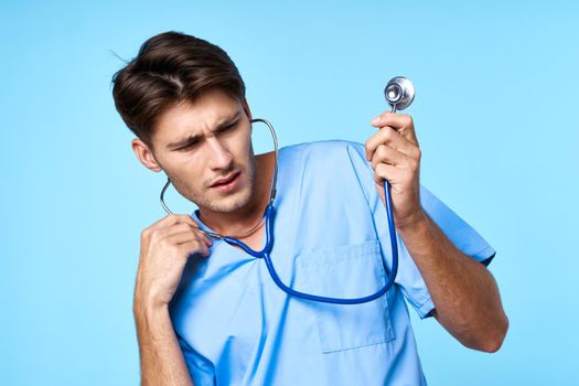 man in medical uniform health care treatment stethoscope examination blue background. High quality photo
