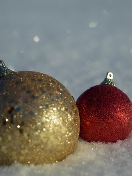 christmas balls tree decoration in fresh snow abstract background