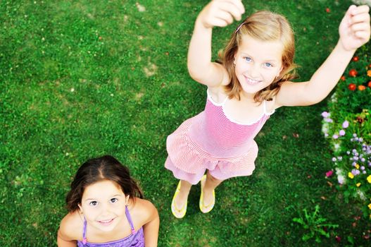 two happy young girls children  have fun outdoor in nature