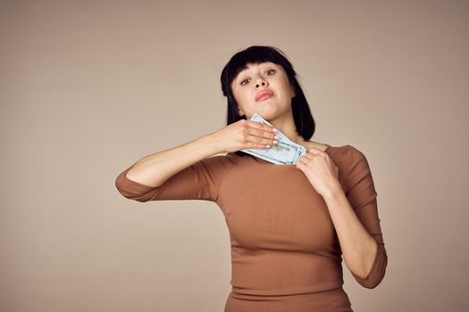 emotional woman with money in hands finance positive. High quality photo