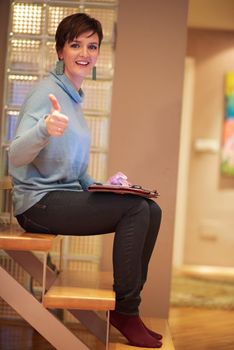 woman at home using tablet computer