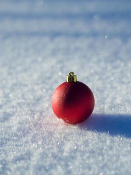 christmas balls tree decoration in fresh snow abstract background