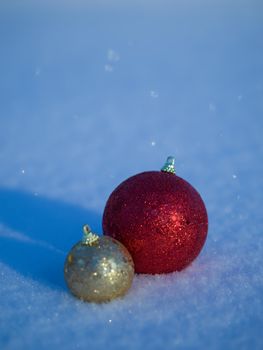 christmas balls tree decoration in fresh snow abstract background