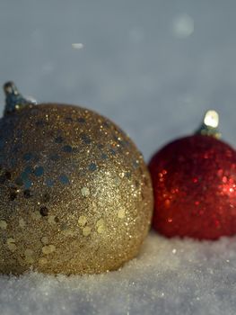 christmas balls tree decoration in fresh snow abstract background