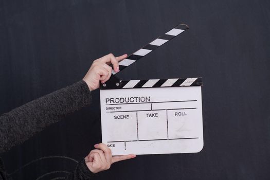 video production movie clapper cinema action and cut concept on balck chalkboard background