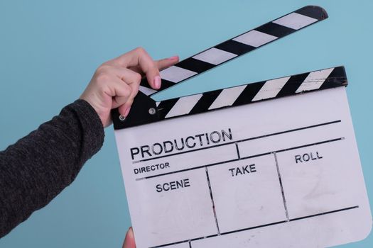 video production movie clapper cinema action and cut concept isolated on cyan  background