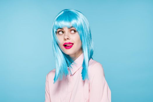 cheerful glamorous woman in pink shirt blue wig makeup model. High quality photo