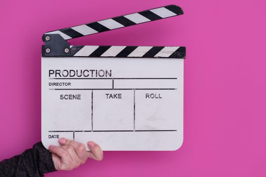 video production movie clapper cinema action and cut concept isolated on pink purple violet background