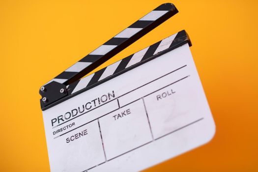 video production movie clapper cinema action and cut concept isolated on yellow background