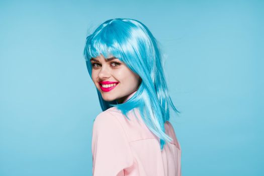 cheerful glamorous woman in pink shirt blue wig makeup model. High quality photo