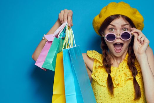 smiling woman in a yellow hat Shopaholic fashion style isolated background. High quality photo