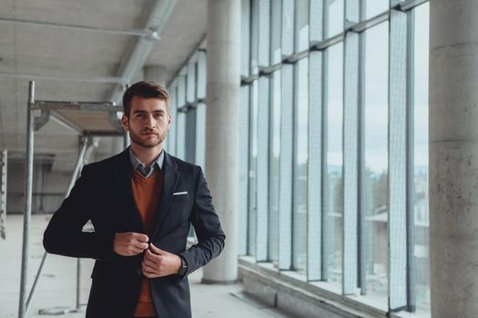 businessman entrepreneur in oversees the construction site of the startup office project