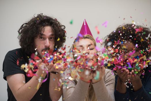 confetti party happy young people group celebrating new year eve while dancing and have fun at home