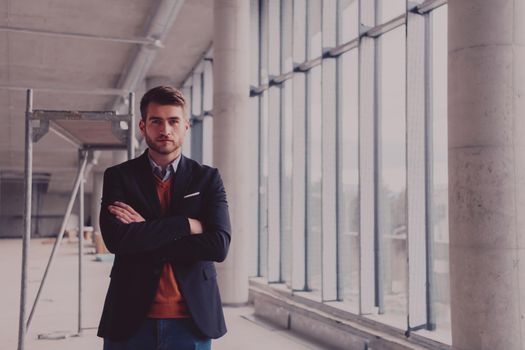 businessman entrepreneur in oversees the construction site of the startup office project