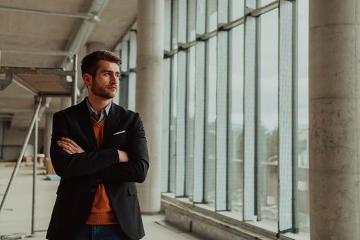 businessman entrepreneur in oversees the construction site of the startup office project