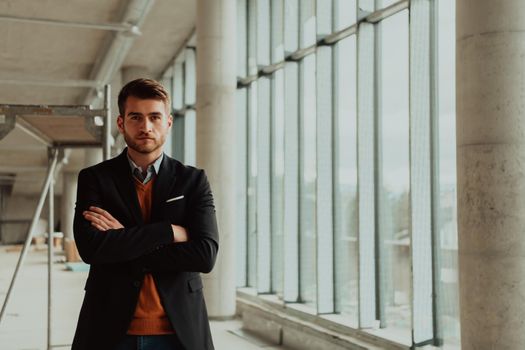 businessman entrepreneur in oversees the construction site of the startup office project