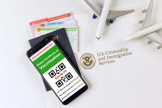 US Immigration Service with Coronavirus Covid-19 vaccination status certificate for required vaccination at the USA entry