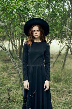 witch in the woods posing costume halloween gothic style. High quality photo