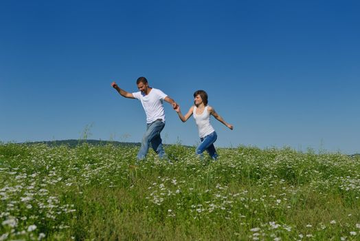 happy young couple in love have romance and fun at wheat field in summer