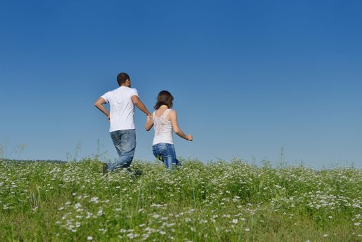 happy young couple in love have romance and fun at wheat field in summer