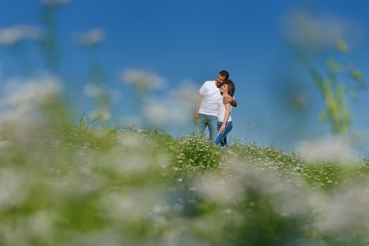 happy young couple in love have romance and fun at wheat field in summer