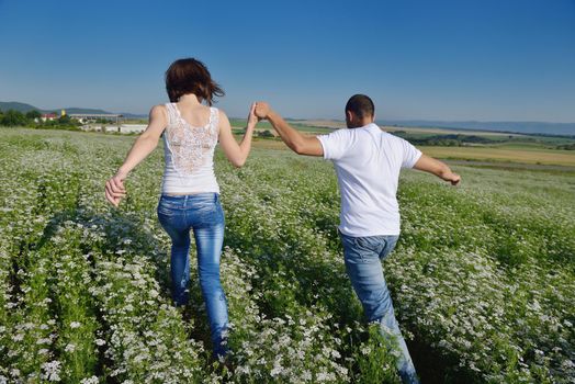 happy young couple in love have romance and fun at wheat field in summer