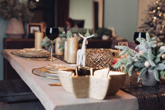 Table served for Christmas dinner in living room. New Year eve concept