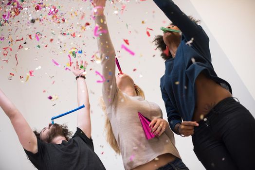 confetti party happy young people group celebrating new year eve while dancing and have fun at home