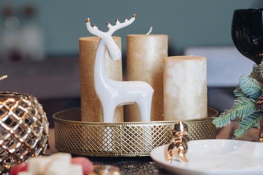 Christmas table in the living room with the objects of holiday decor. New Year eve concept