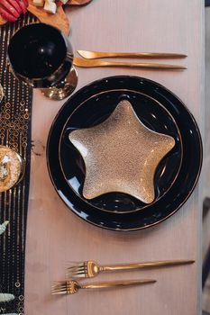 Top view of festive table setting for New Year celebration at home. New Year eve concept