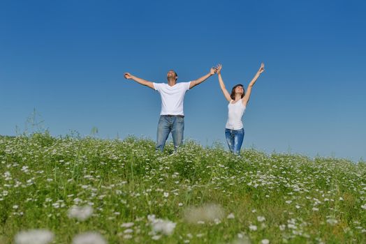 happy young couple in love have romance and fun at wheat field in summer