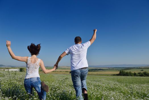 happy young couple in love have romance and fun at wheat field in summer