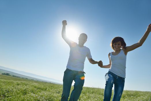 happy young couple in love have romance and fun at wheat field in summer