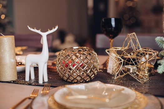 Table served for Christmas dinner in living room. New Year eve concept