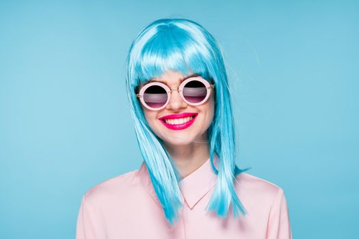 beautiful woman in blue wig sunglasses Glamor fashion. High quality photo