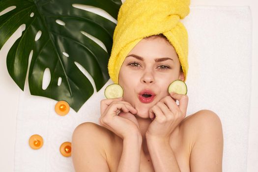 attractive woman with a towel on my head skin care view from above. High quality photo
