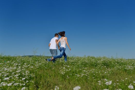 happy young couple in love have romance and fun at wheat field in summer