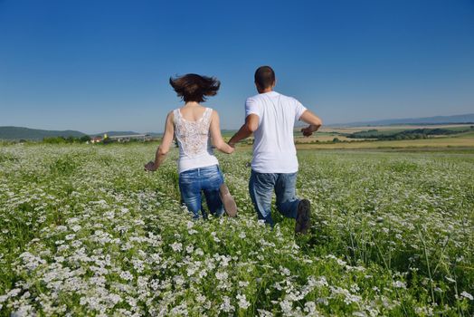 happy young couple in love have romance and fun at wheat field in summer