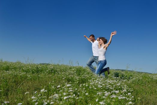 happy young couple in love have romance and fun at wheat field in summer