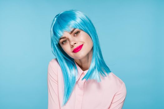 cheerful glamorous woman in pink shirt blue wig makeup model. High quality photo