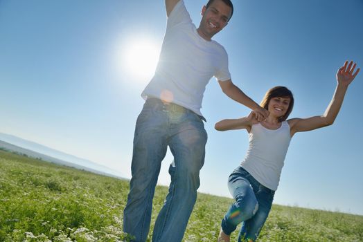 happy young couple in love have romance and fun at wheat field in summer