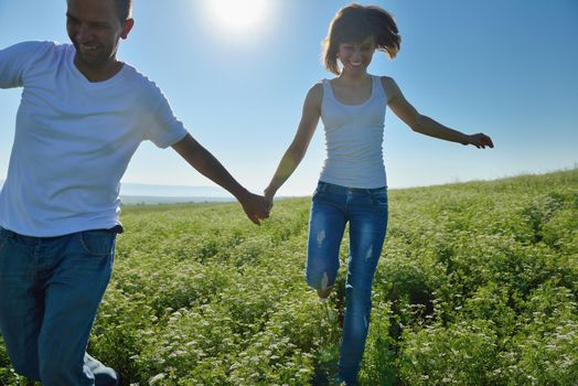 happy young couple in love have romance and fun at wheat field in summer