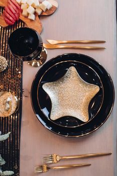 Top view of festive table setting for New Year celebration at home. New Year eve concept