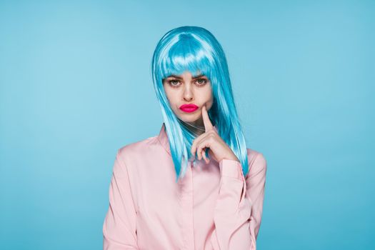 cheerful glamorous woman in pink shirt blue wig makeup model. High quality photo